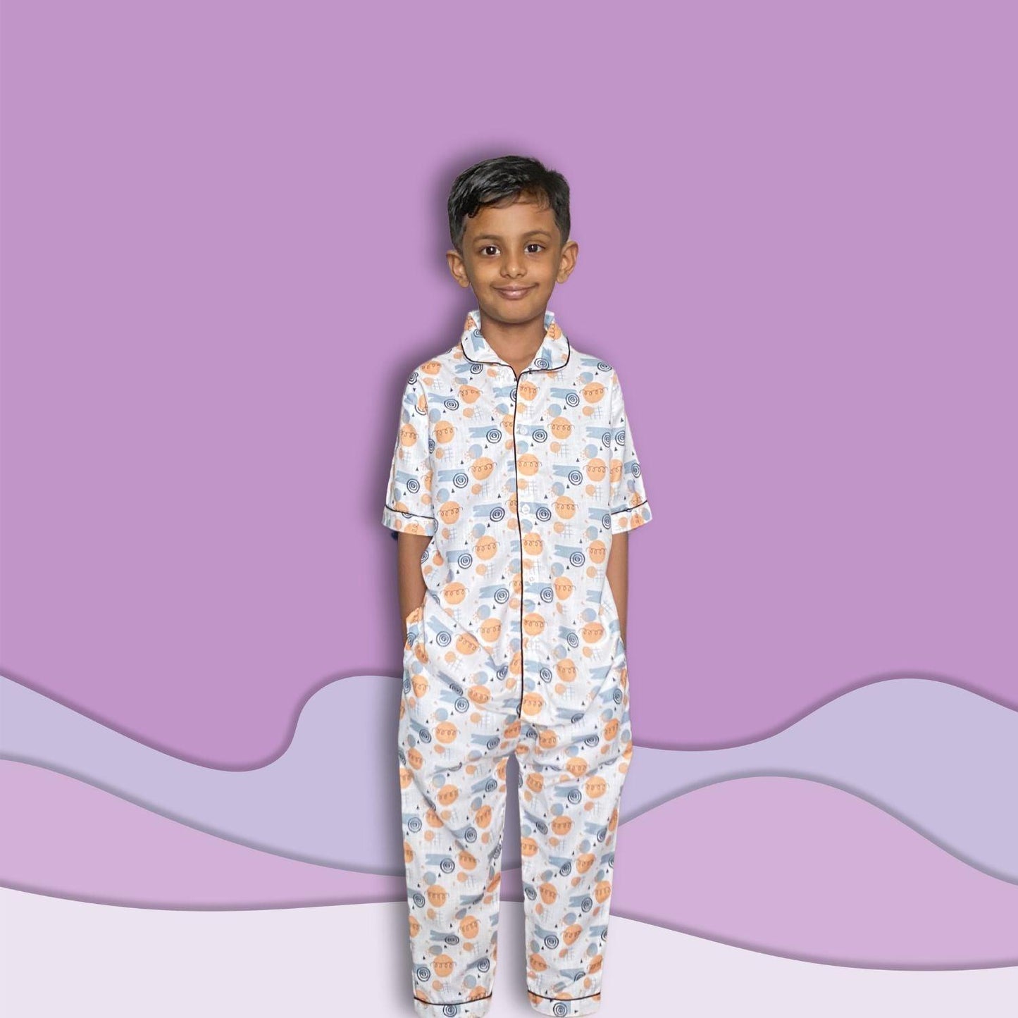 Doodle Pajama Set by RedBerry Cuddle, a unisex night suit for kids made from 100% cotton. The set is adorned with playful and creative doodle designs, offering comfort and style for bedtime.
