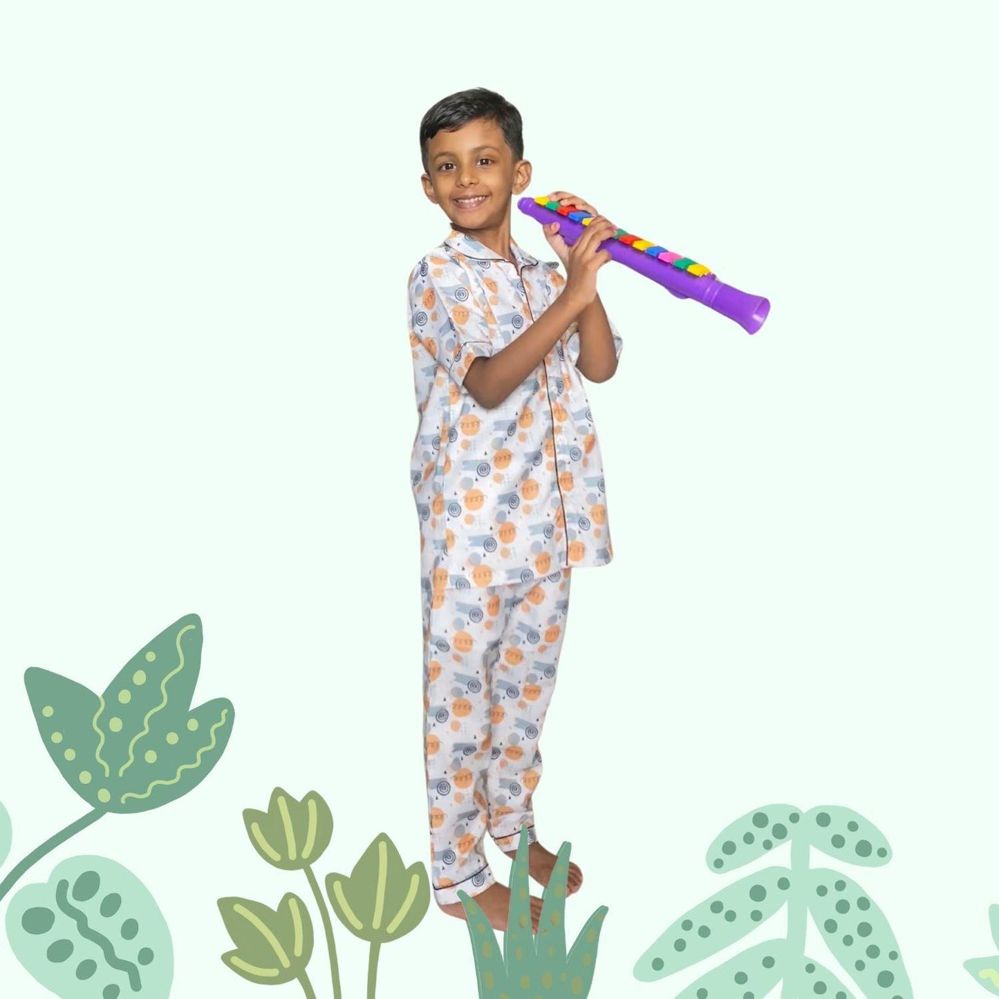 Doodle Pajama Set by RedBerry Cuddle, a unisex night suit for kids made from 100% cotton. The set is adorned with playful and creative doodle designs, offering comfort and style for bedtime.