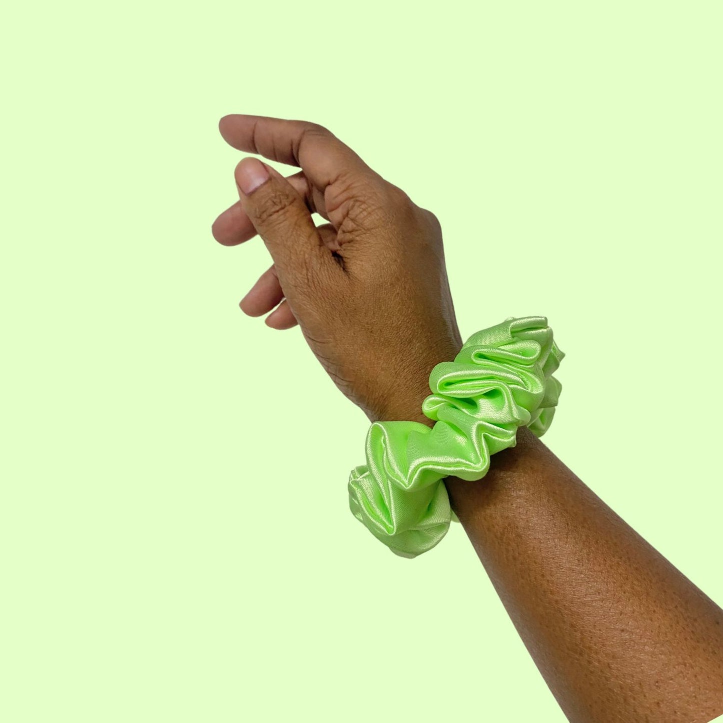 Lime Green Scrunchie in small size by RedBerry Cuddle. A bright, refreshing green hair accessory with a soft, plush texture, designed for a secure and stylish hold.