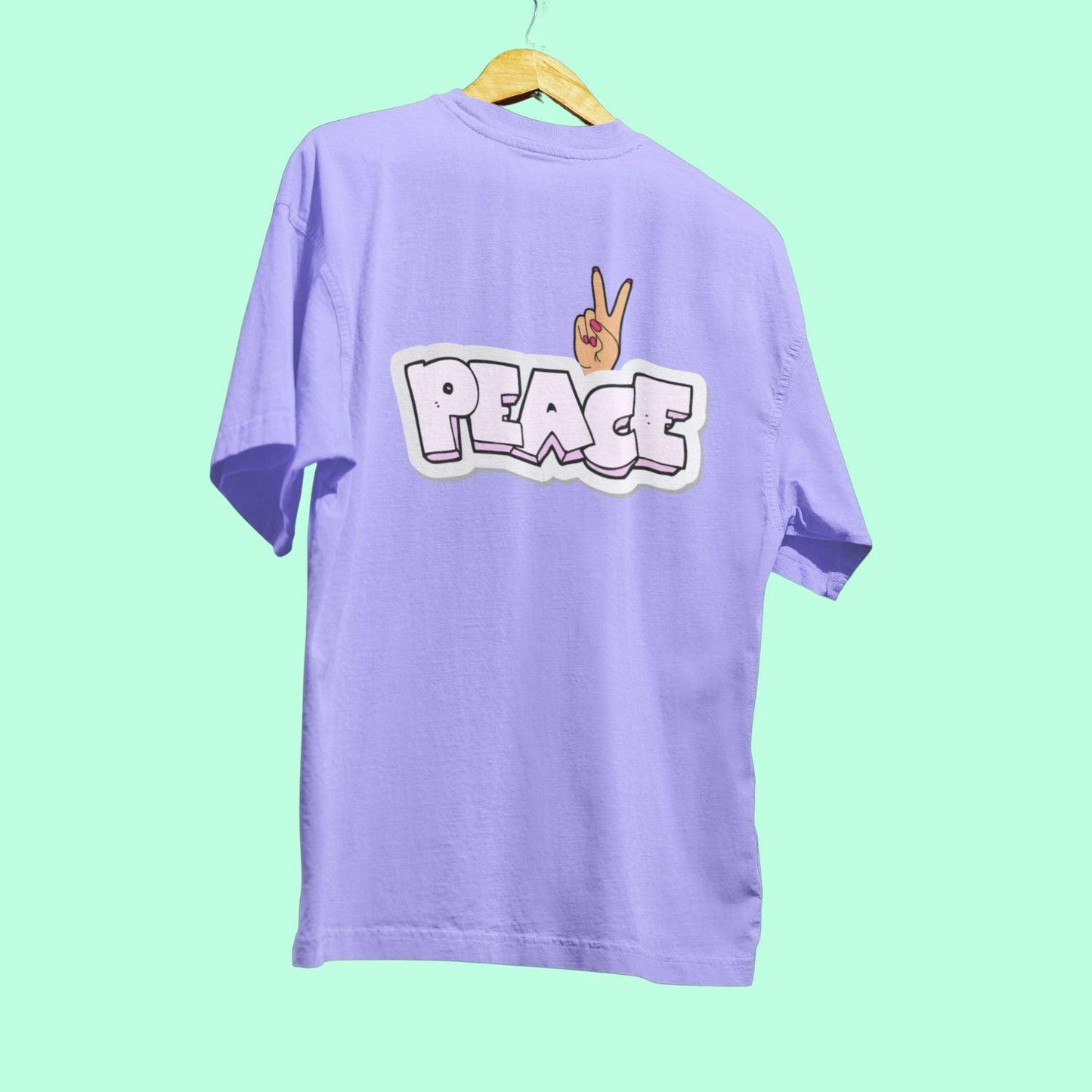PEACE Women's Oversized T-shirt by RedBerry Cuddle, made from 100% cotton. It features a bold 'PEACE' design, offering a relaxed and comfortable fit for everyday wear.
