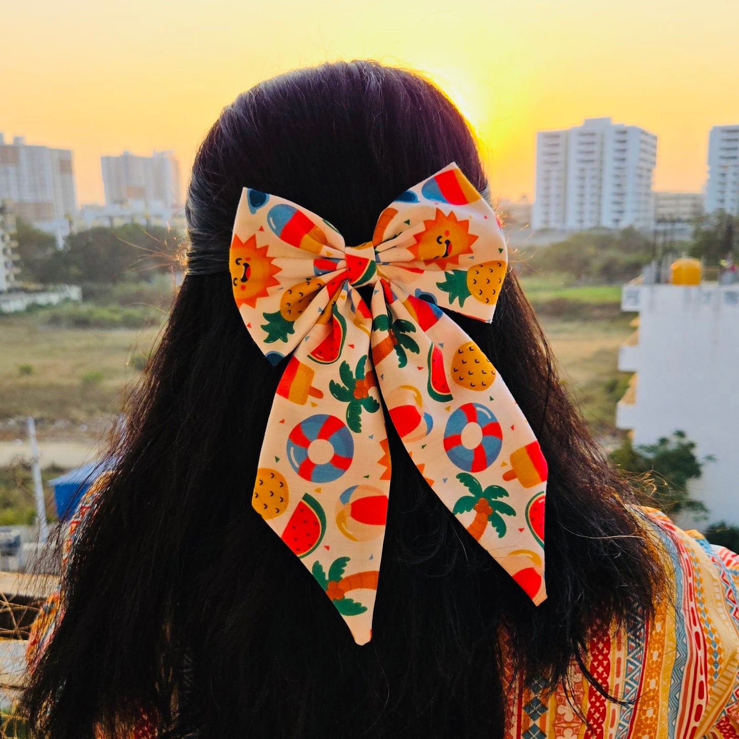 Sunny Beach Doodle Midi Tail Hair Bow by RedBerry Cuddle. A fun and vibrant hair accessory featuring a midi-length bow with a playful beach-themed doodle design, crafted from high-quality fabric for a secure and stylish look.