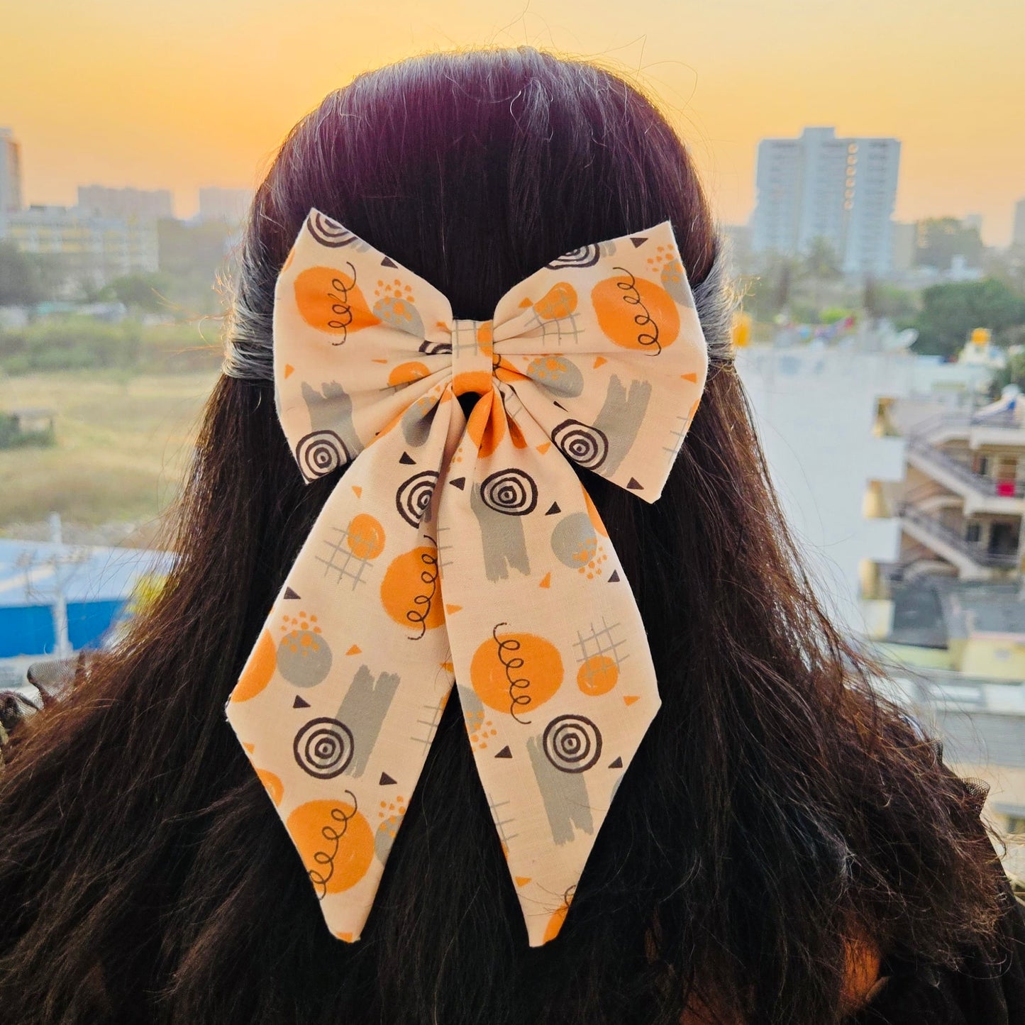 Doodle Midi Tail Hair Bow by RedBerry Cuddle. A fun and artistic hair accessory featuring a midi-length bow with a playful doodle-inspired design, crafted from high-quality fabric for a secure and stylish look.