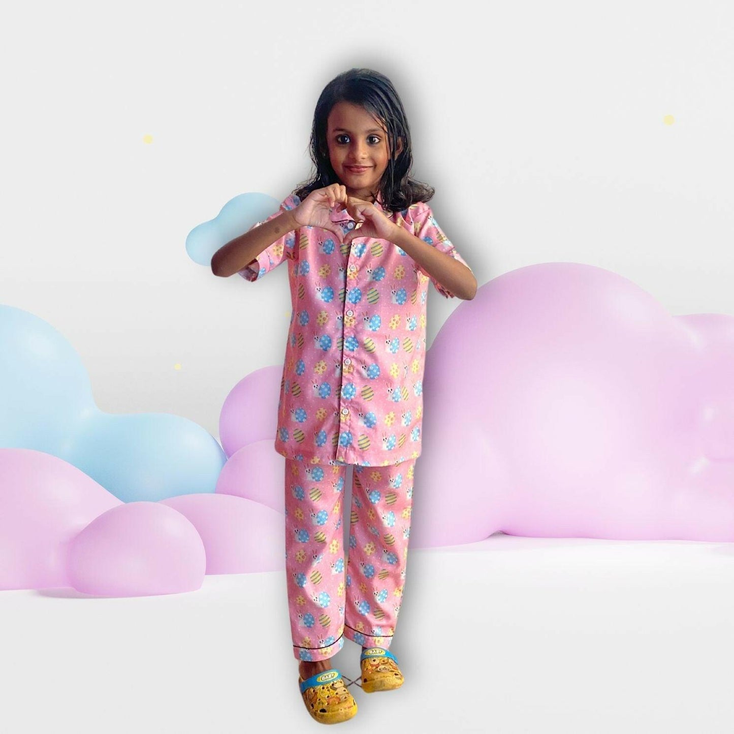 Easter Egg Pink Pajama Set by RedBerry Cuddle, made from 100% cotton. A soft and cozy unisex pajama set in a cheerful pink hue, designed for kids to enjoy comfortable sleep.