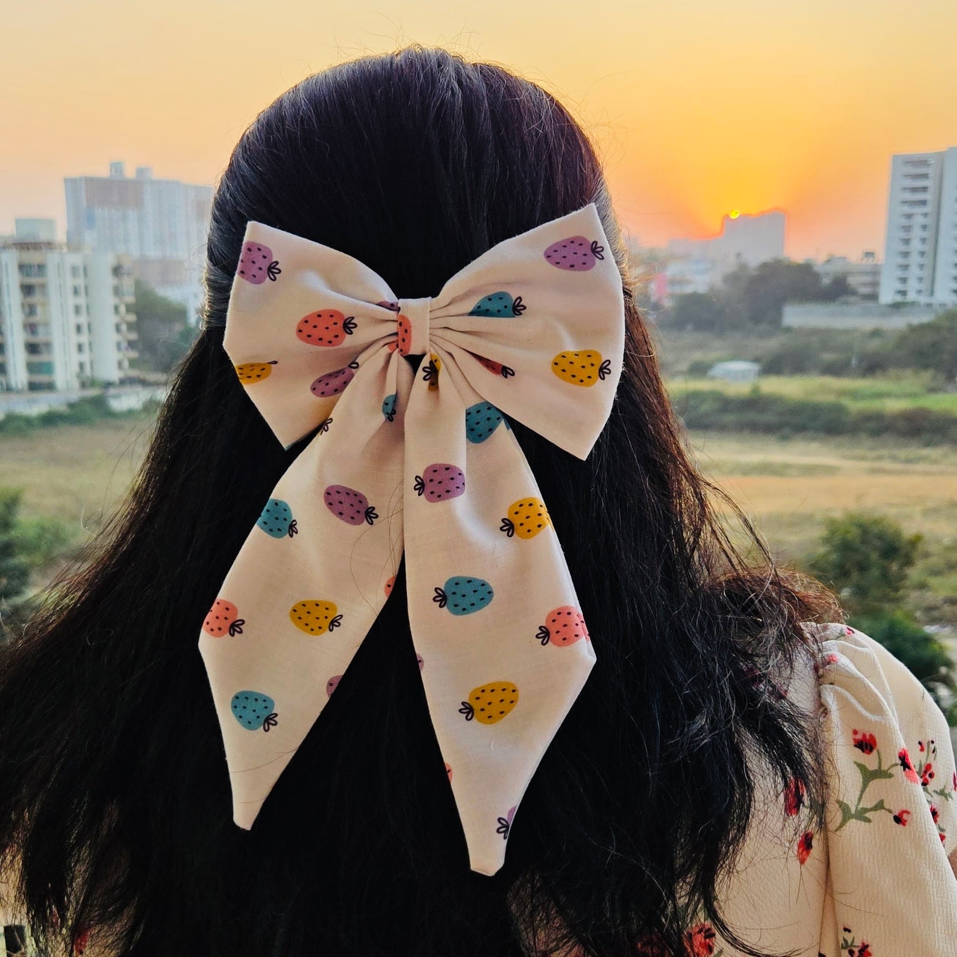 Strawberry Midi Tail Hair Bow by RedBerry Cuddle. A sweet and stylish hair accessory featuring a midi-length bow with a charming strawberry-themed design, crafted from high-quality fabric for a secure and adorable look.