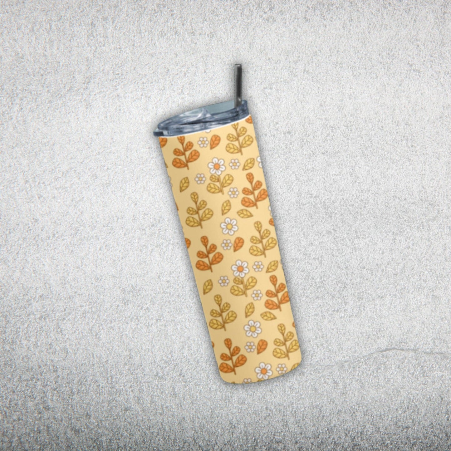 Yellow Leaf Tumbler Bottle by RedBerry Cuddle, a 20 oz stainless steel tumbler with a metal straw. It showcases a stylish yellow leaf design, double wall insulation, and a splash-proof lid.