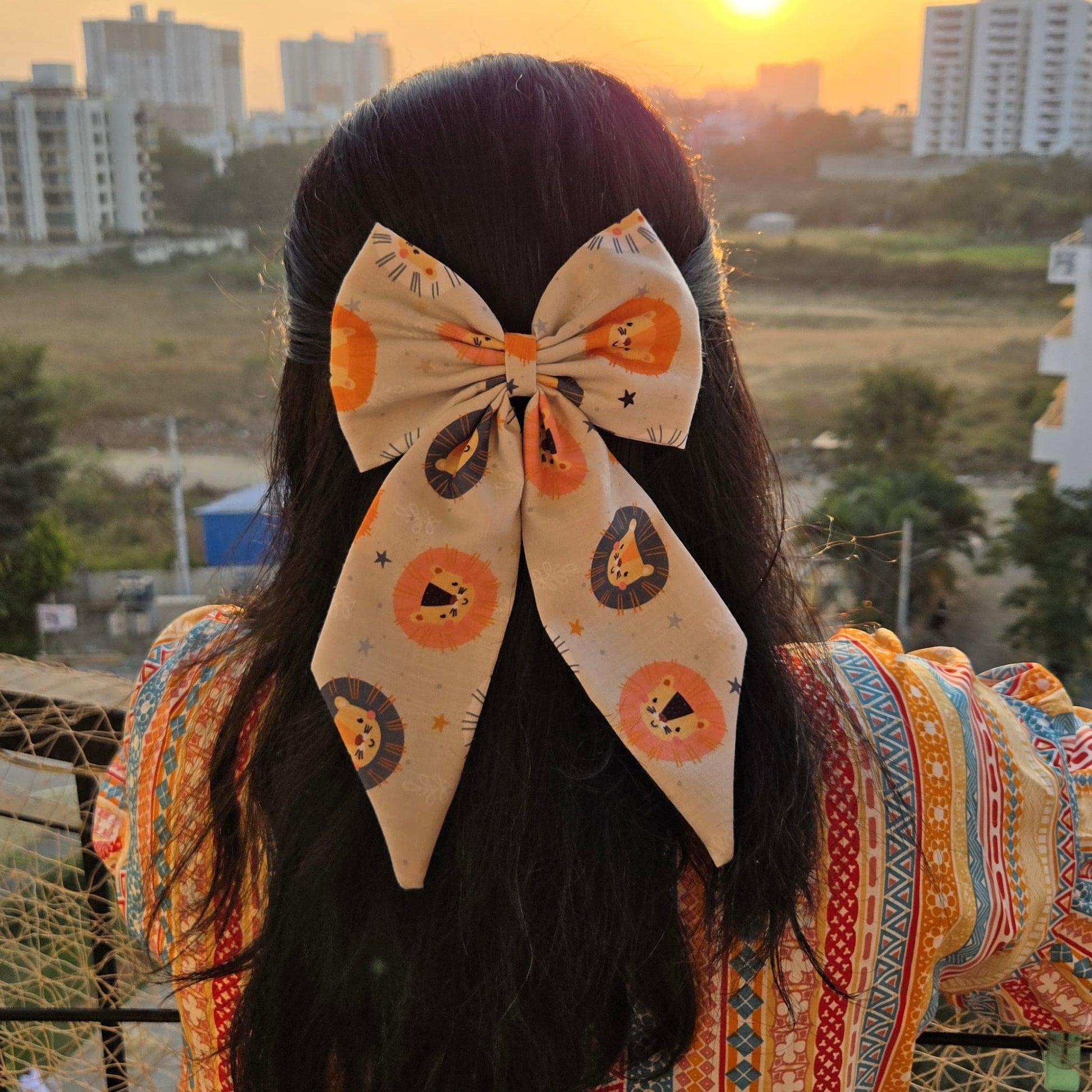 Lion Midi Tail Hair Bow by RedBerry Cuddle. A bold and stylish hair accessory featuring a midi-length bow with a majestic lion-inspired design, crafted from high-quality fabric for a secure and fashionable look.