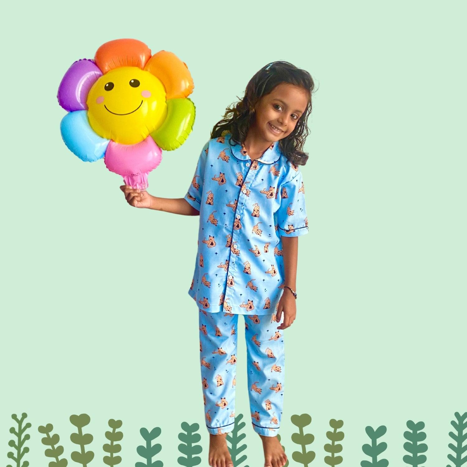 Wild Cat Pajama Set by RedBerry Cuddle, a unisex night suit for kids made from 100% cotton. The set features a playful wild cat print, designed for comfort and style during bedtime.