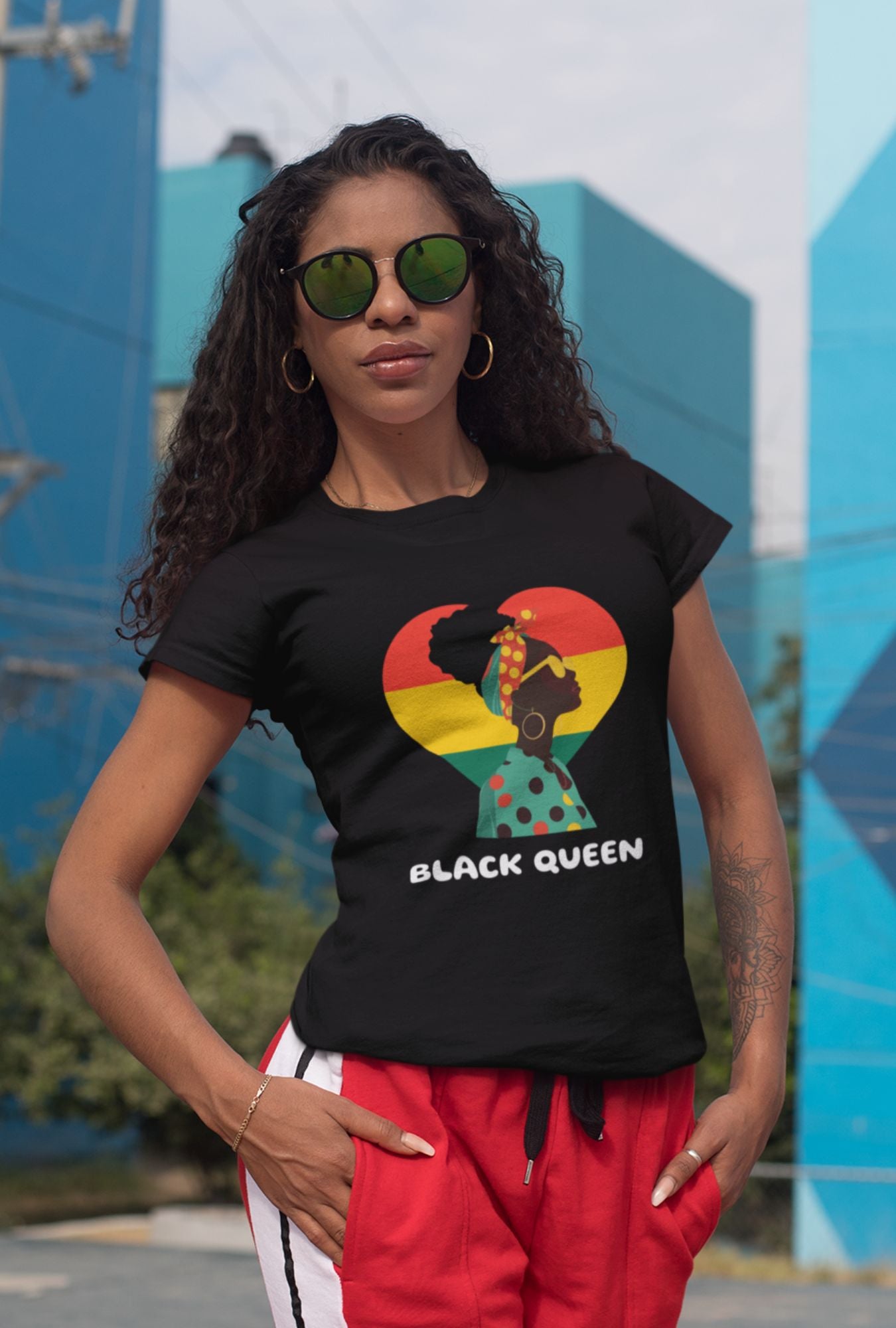 Black Queen Women's T-shirt by RedBerry Cuddle, made from 100% cotton. It features a powerful 'Black Queen' design, offering comfort with a statement of confidence and pride.