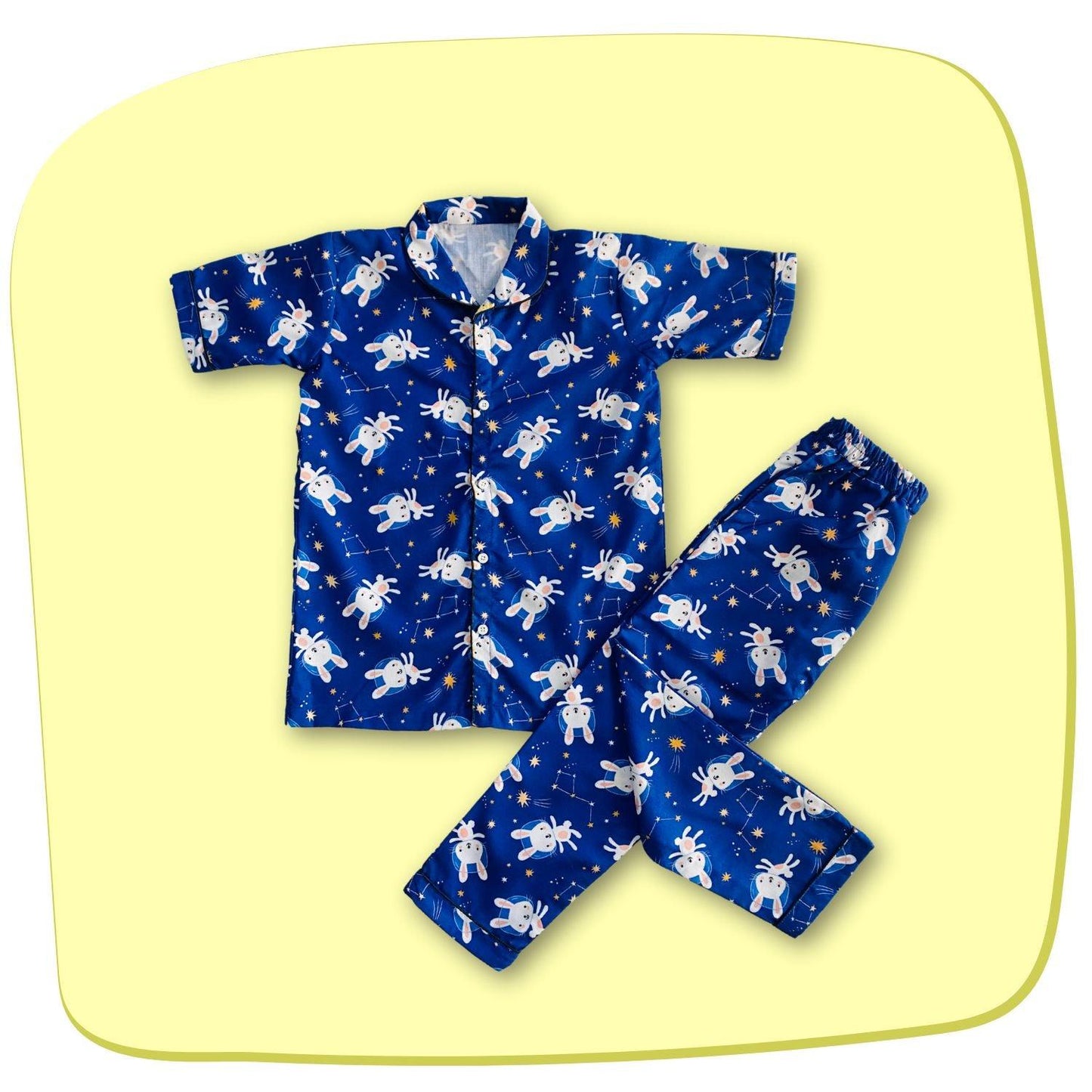 Bunny Space Pajama Set by RedBerry Cuddle, a unisex night suit for kids made from 100% cotton. The set showcases a fun space-themed design with bunnies, offering both comfort and charm for bedtime.