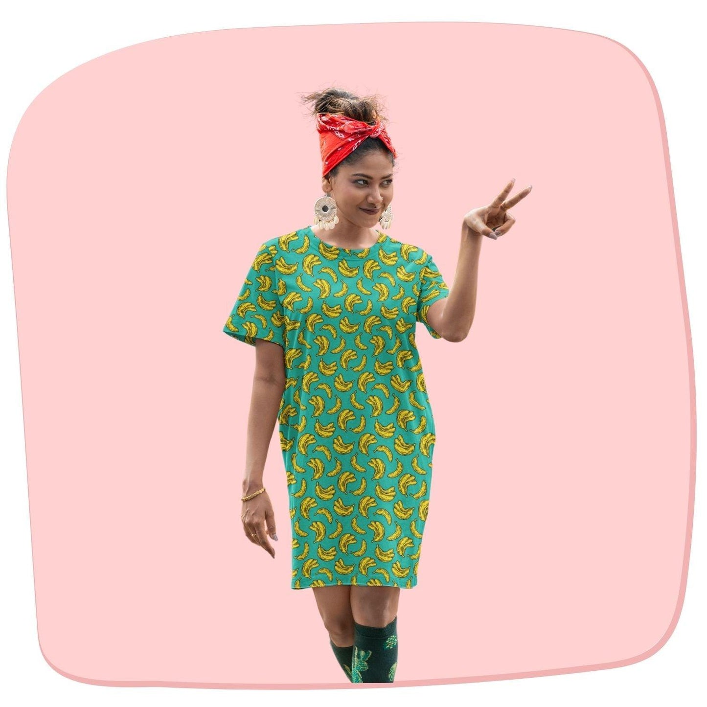 Banana Women's T-shirt Dress by RedBerry Cuddle, featuring a playful banana design. Made from fade-proof fabric, it includes two convenient pockets for added comfort and style.