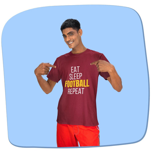 Eat Sleep Football Repeat Men's T-shirt by RedBerry Cuddle, made from 100% cotton. It features a fun, football-themed slogan, perfect for sports enthusiasts looking for comfort and style.