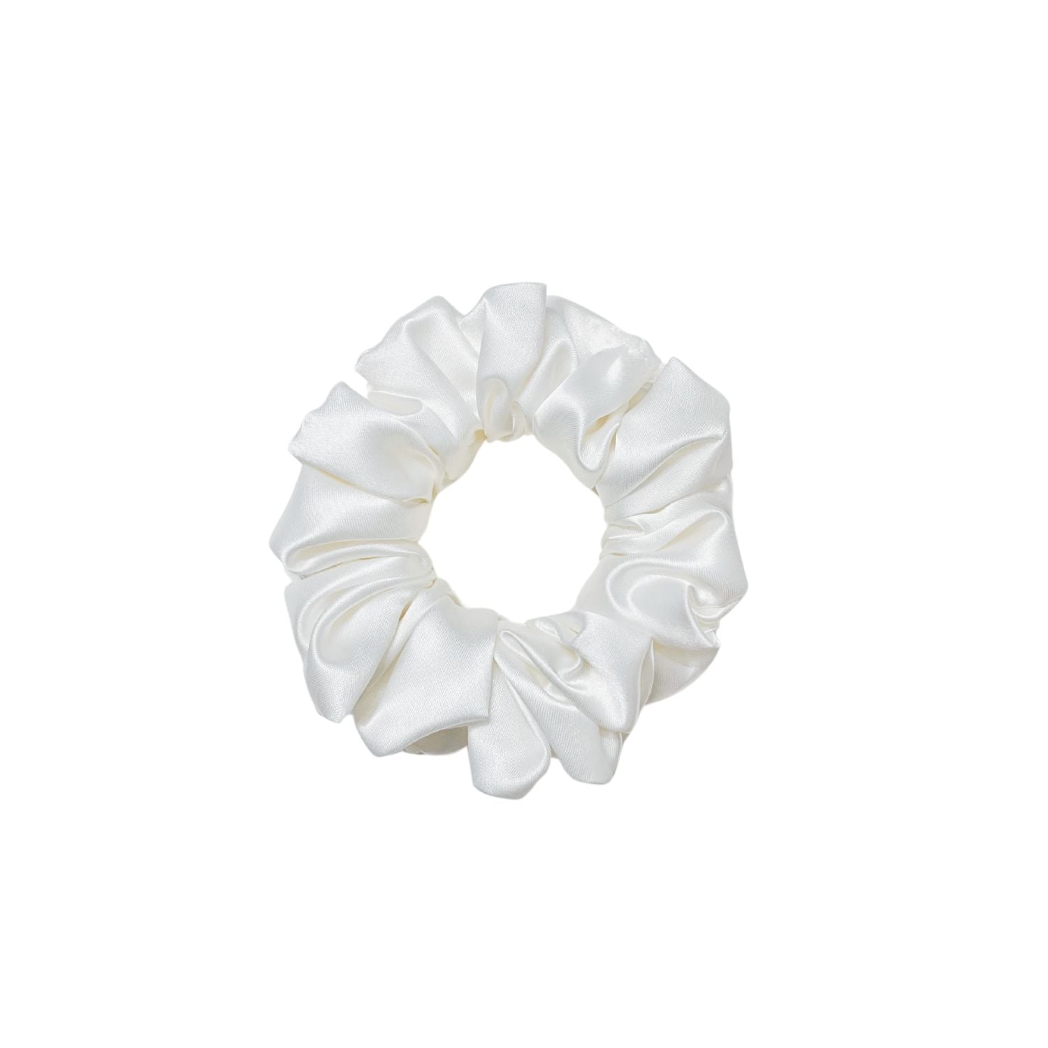 White Scrunchie in medium size by RedBerry Cuddle. A classic, soft white hair accessory with a plush texture, offering a secure and comfortable hold.