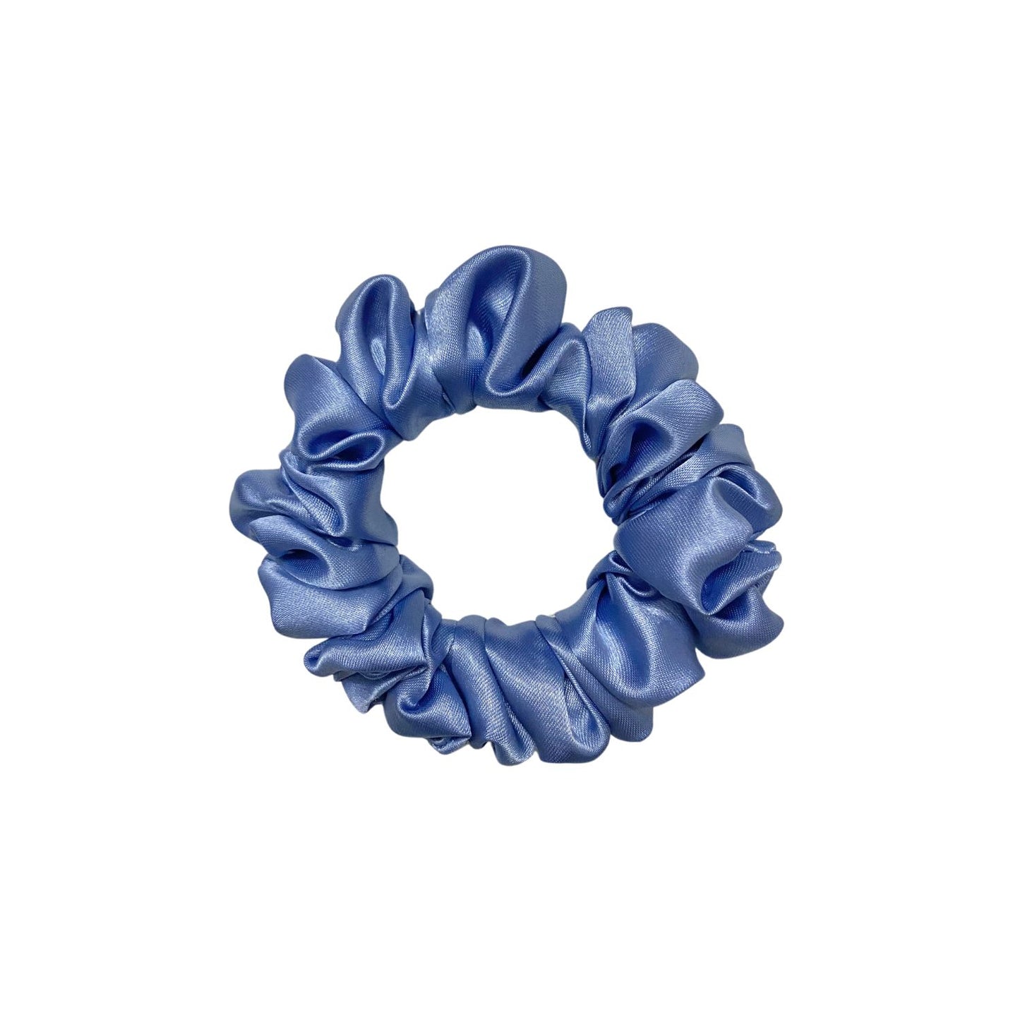 Glaucous Blue Scrunchie in small size by RedBerry Cuddle. A soft, muted blue hair accessory with a plush texture, designed for a secure and stylish hold.