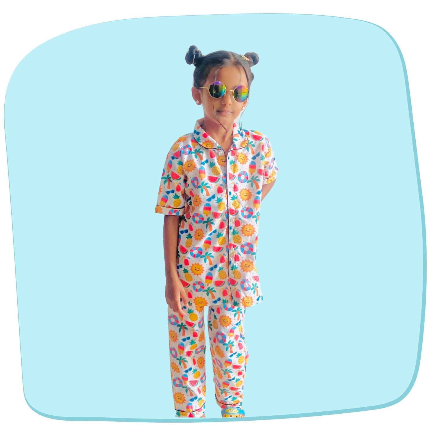 Sunny Beach Doodle Pajama Set by RedBerry Cuddle, made from 100% cotton. A soft and cheerful unisex pajama set for kids, featuring fun beach-themed doodles, perfect for comfortable and playful sleep.