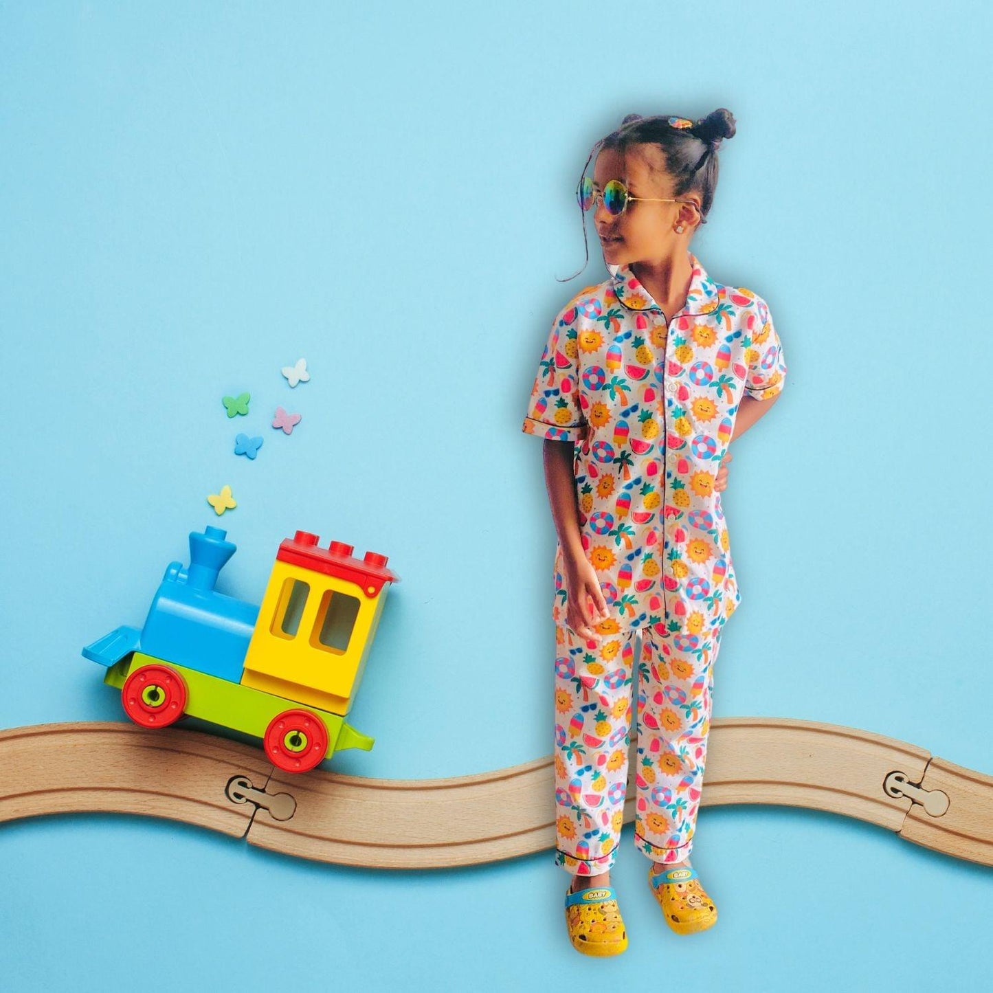 Sunny Beach Doodle Pajama Set by RedBerry Cuddle, made from 100% cotton. A soft and cheerful unisex pajama set for kids, featuring fun beach-themed doodles, perfect for comfortable and playful sleep.