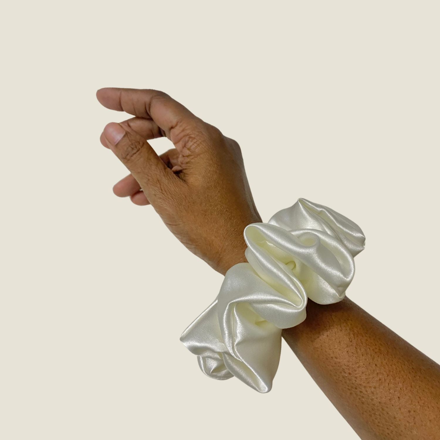 White Scrunchie in large size by RedBerry Cuddle. A classic, soft white hair accessory with a plush texture, designed for a secure and stylish hold.