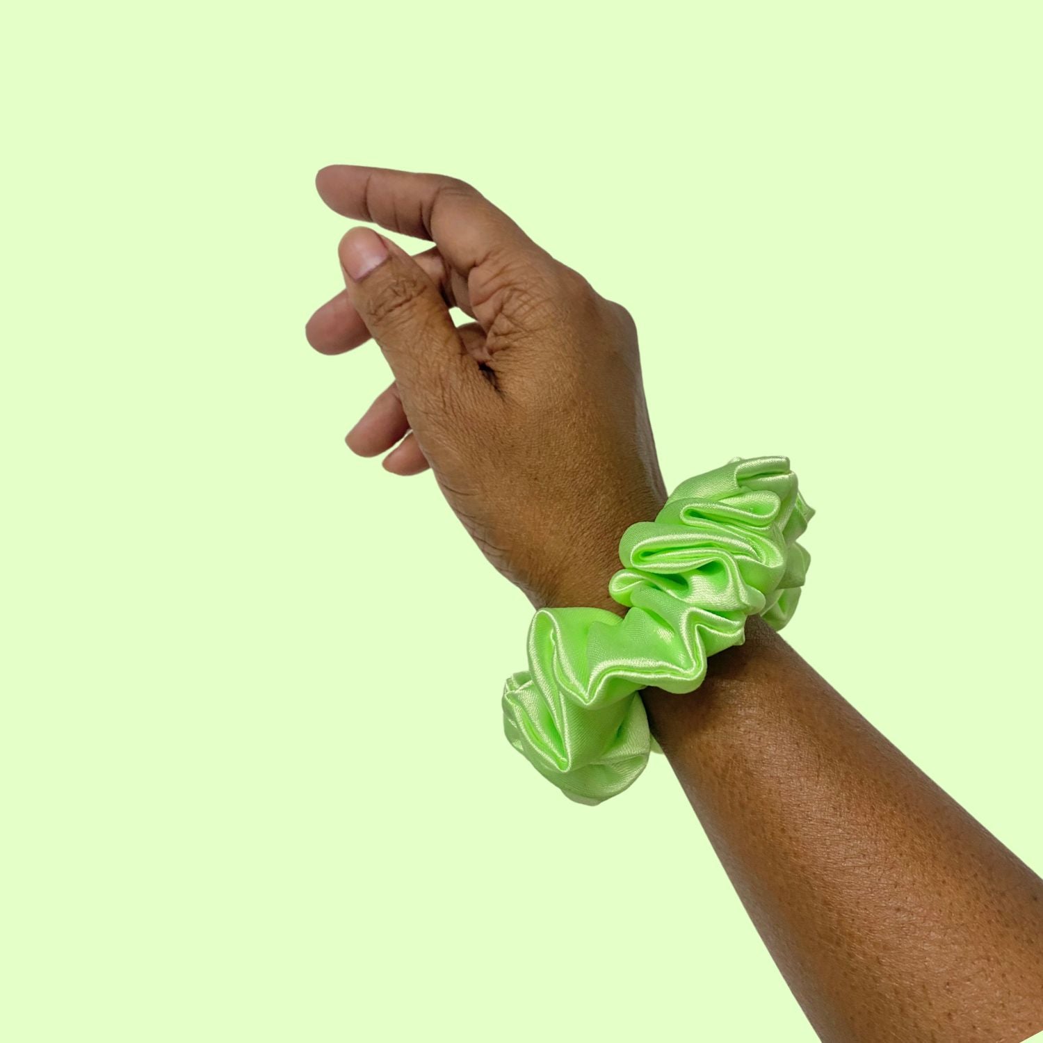 Lime Green Scrunchie in small size by RedBerry Cuddle. A bright, refreshing green hair accessory with a soft, plush texture, designed for a secure and stylish hold.
