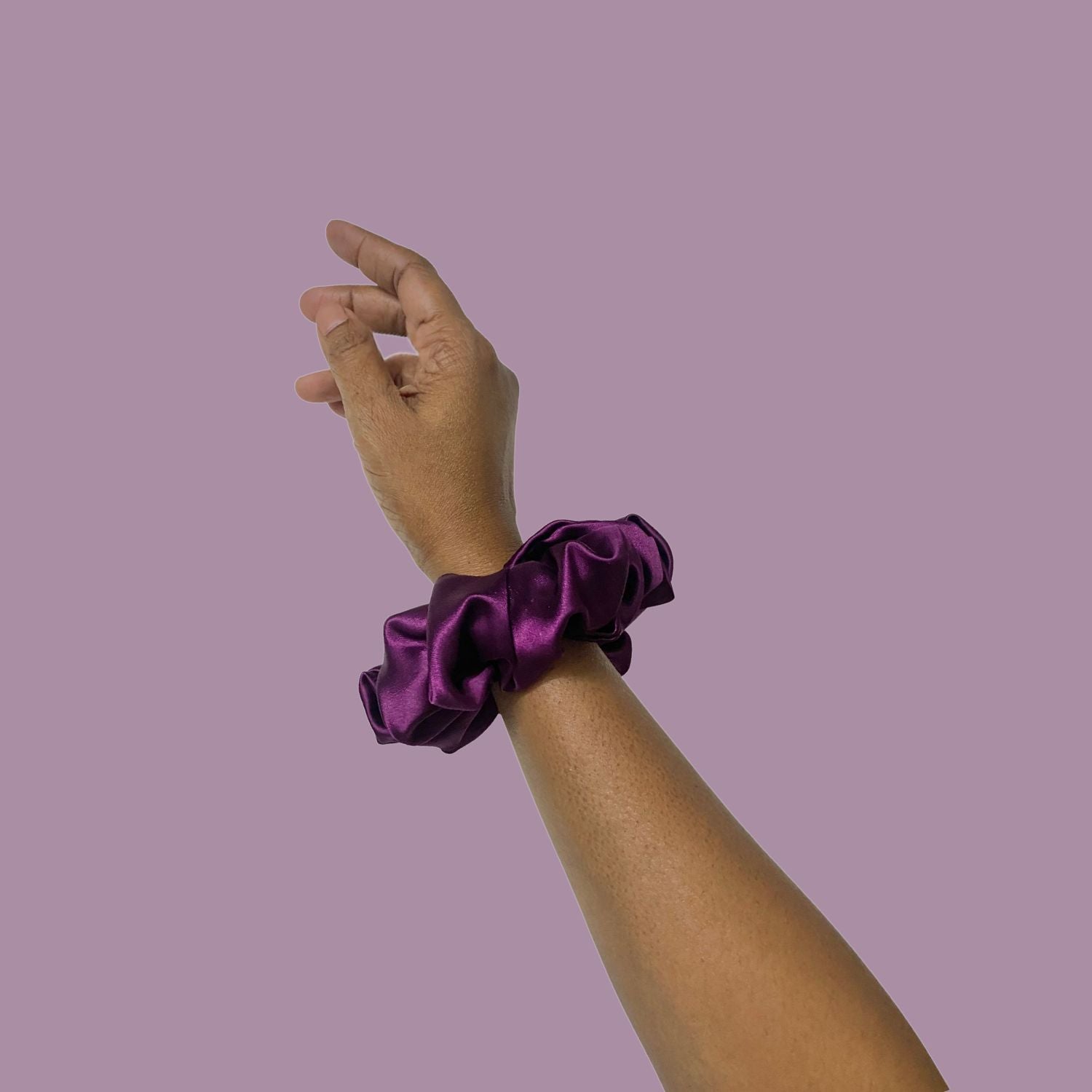 Grape Purple Scrunchie in medium size by RedBerry Cuddle. A rich, deep purple hair accessory with a soft, plush texture, offering a secure and comfortable hold.