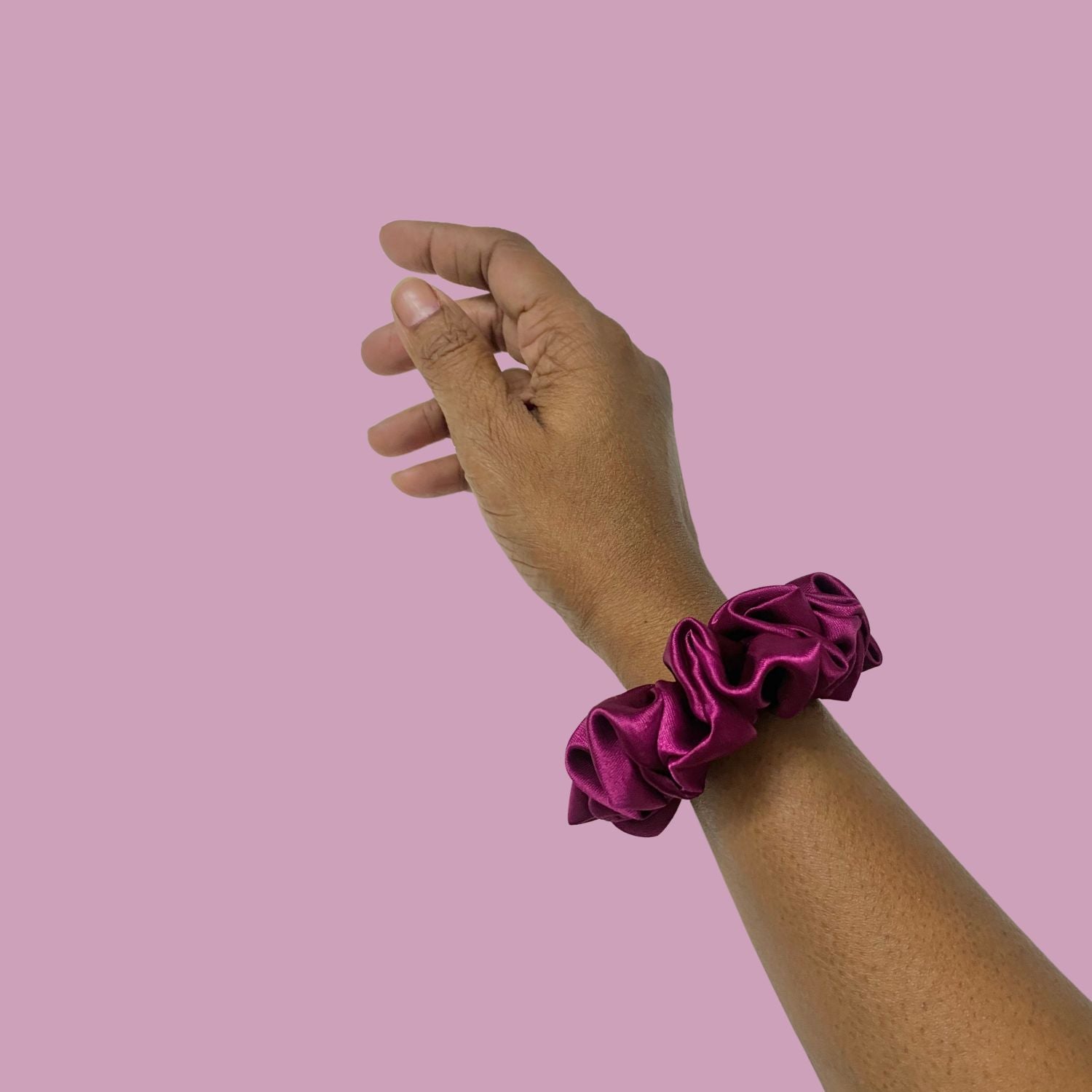 Imperial Purple Scrunchie in small size, made by RedBerry Cuddle. The scrunchie is a rich, deep purple color with a soft, plush texture, designed to add a stylish and comfortable touch to any hairstyle.