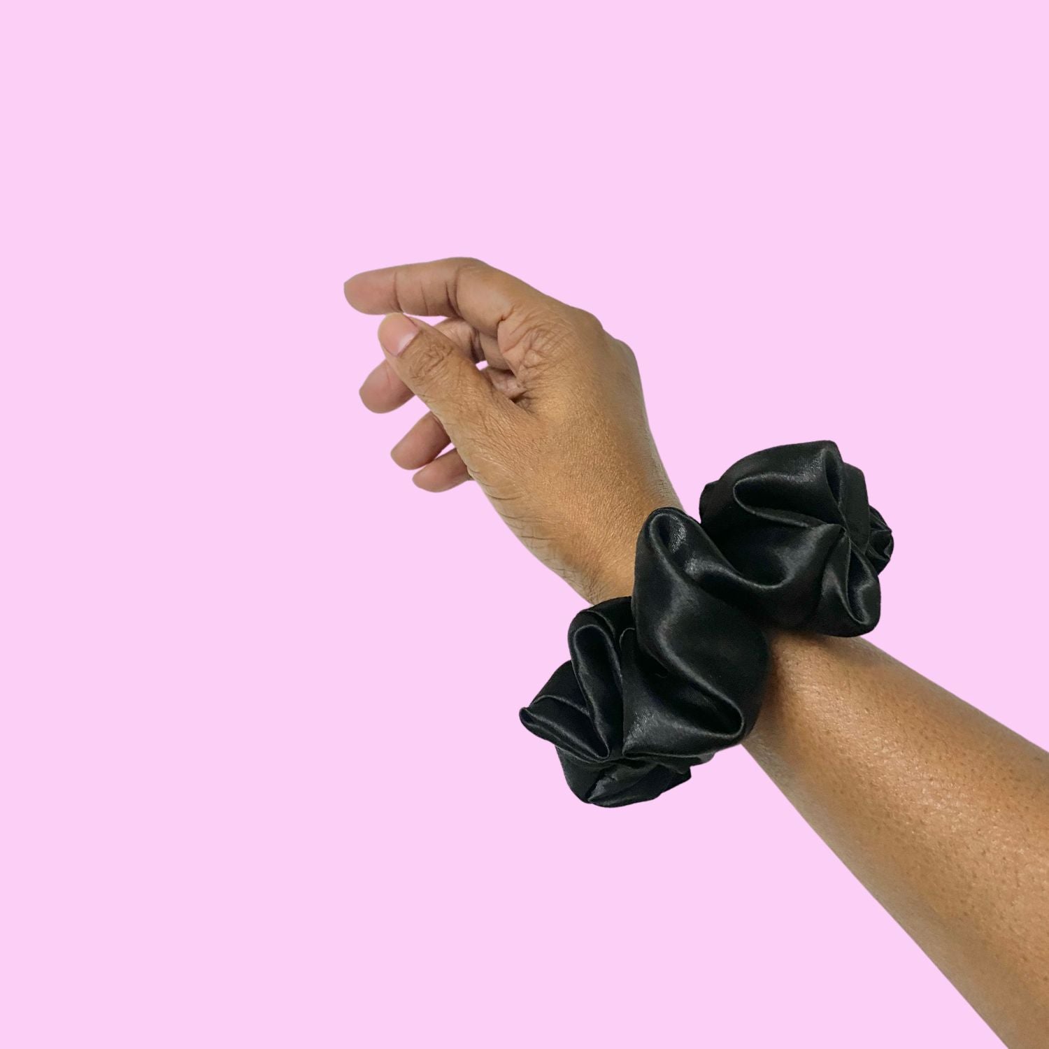 Black Medium Size Scrunchie by RedBerry Cuddle, a classic and versatile hair accessory designed for a secure and comfortable hold, suitable for various hairstyles.