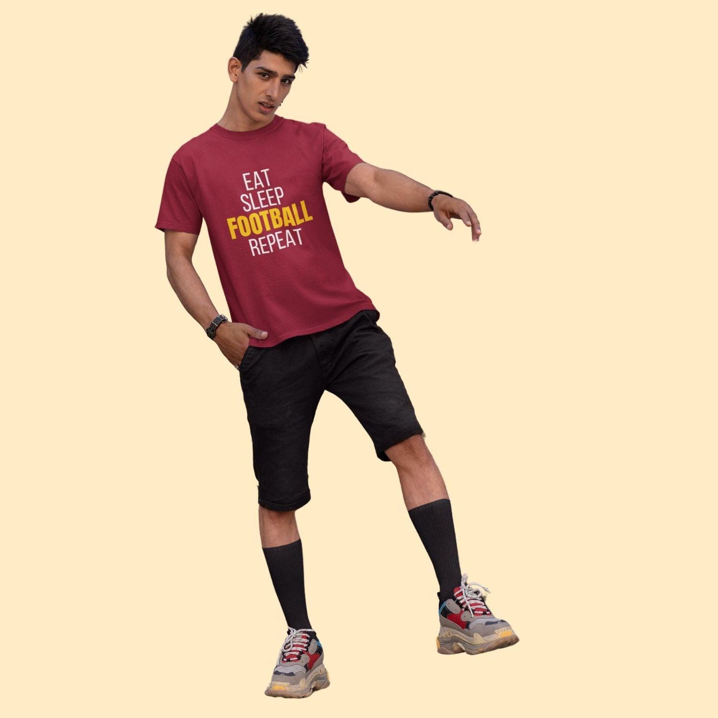 Eat Sleep Football Repeat Men's T-shirt by RedBerry Cuddle, made from 100% cotton. It features a fun, football-themed slogan, perfect for sports enthusiasts looking for comfort and style.