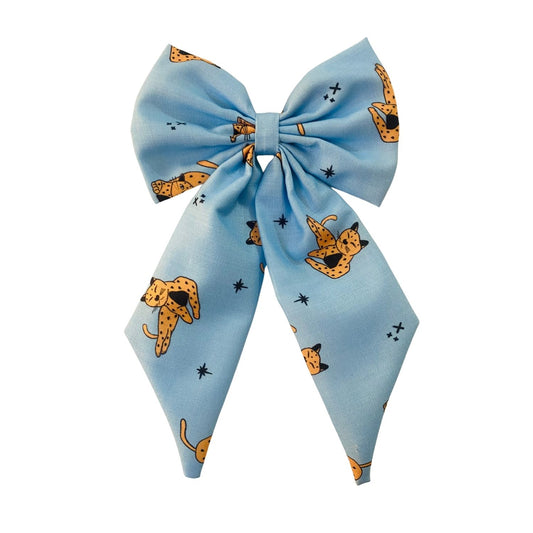 Wild Cat Midi Tail Hair Bow by RedBerry Cuddle. A bold and stylish hair accessory featuring a midi-length bow with a fierce wild cat-inspired print, crafted from high-quality fabric for a secure and fashionable look.