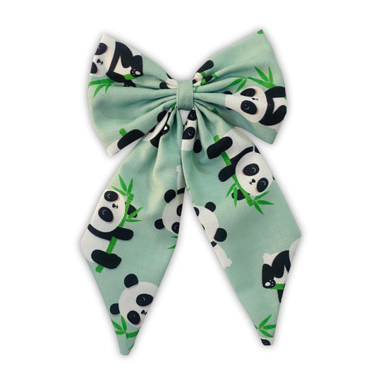 Panda Midi Tail Hair Bow by RedBerry Cuddle. A cute and stylish hair accessory featuring a midi-length bow with an adorable panda-inspired design, crafted from high-quality fabric for a secure and charming look.