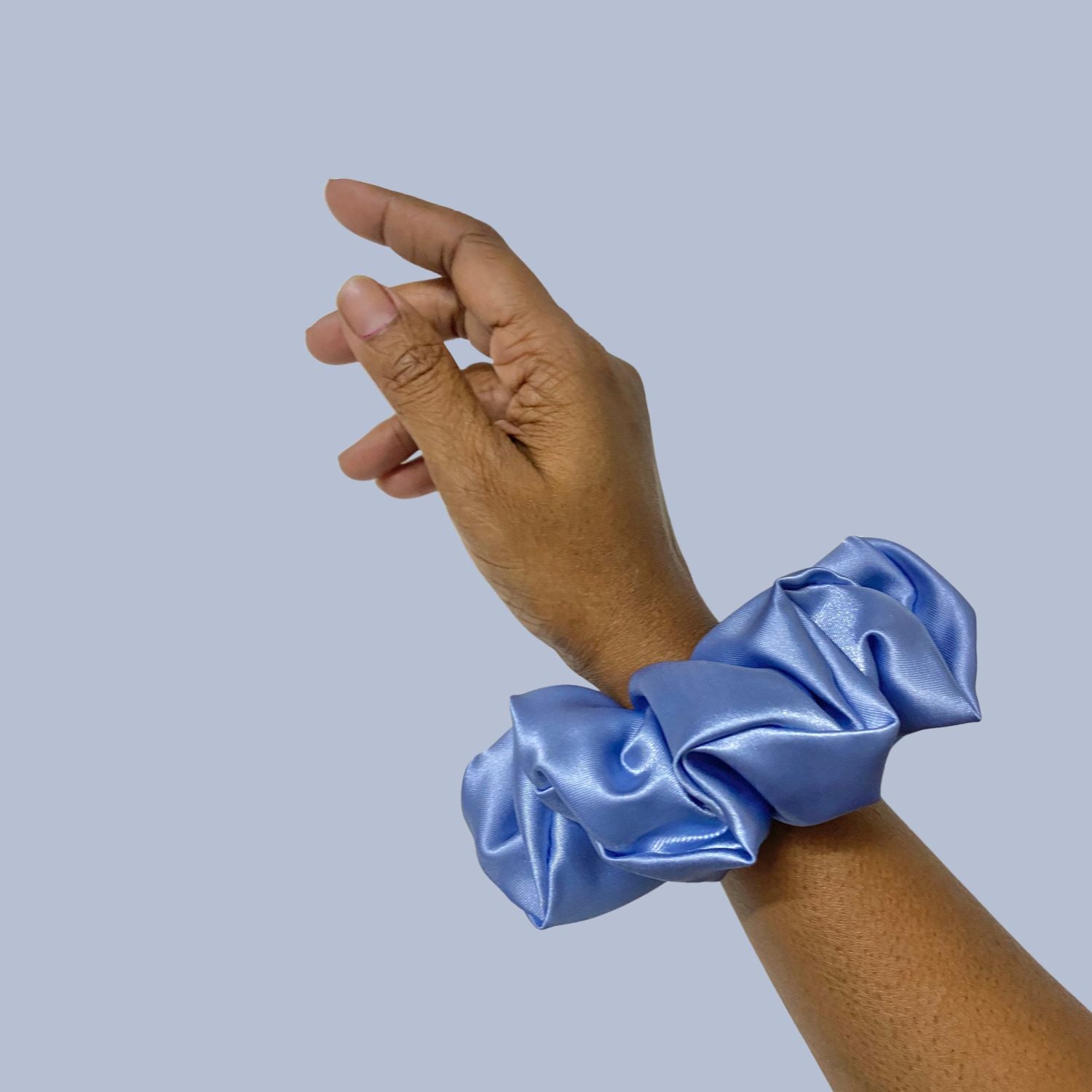 Glaucous Blue Scrunchie in large size by RedBerry Cuddle. A soft, muted blue hair accessory with a plush texture, designed for a secure and stylish hold.