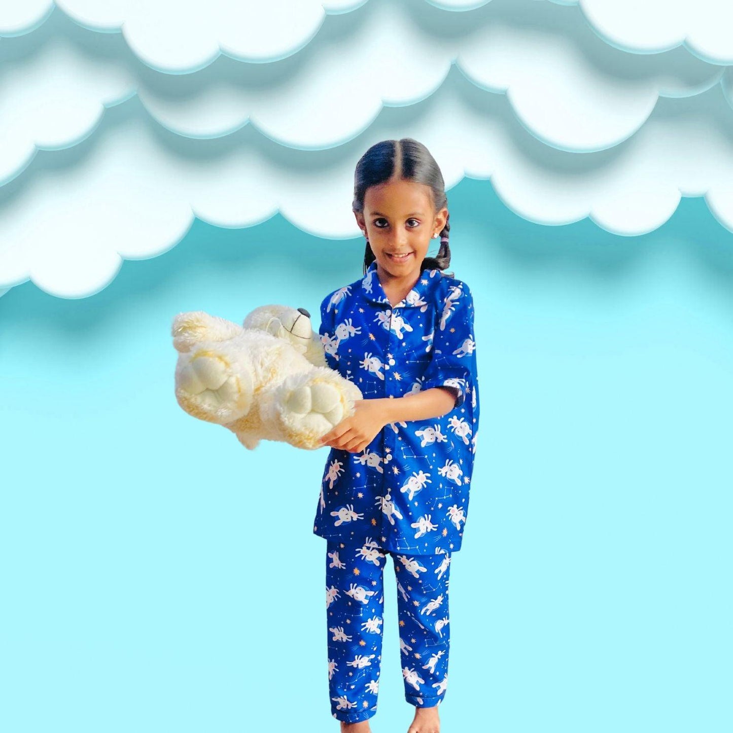 Bunny Space Pajama Set by RedBerry Cuddle, a unisex night suit for kids made from 100% cotton. The set showcases a fun space-themed design with bunnies, offering both comfort and charm for bedtime.