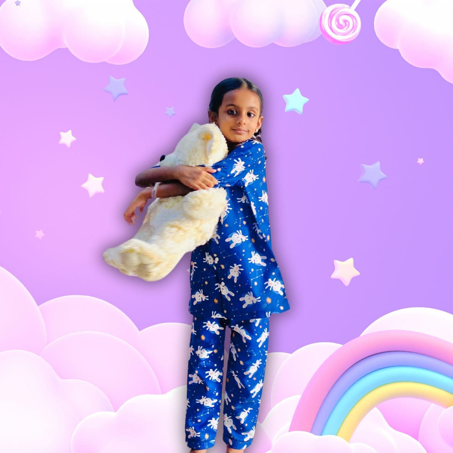 Bunny Space Pajama Set by RedBerry Cuddle, a unisex night suit for kids made from 100% cotton. The set showcases a fun space-themed design with bunnies, offering both comfort and charm for bedtime.