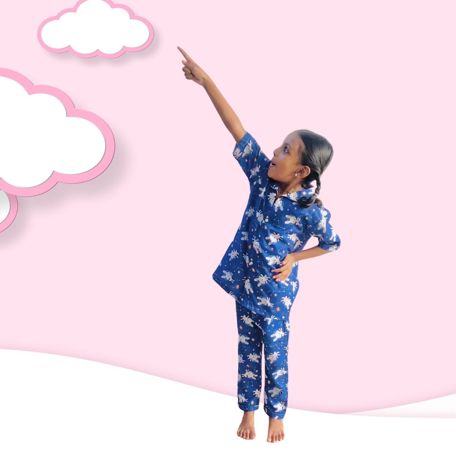 Bunny Space Pajama Set by RedBerry Cuddle, a unisex night suit for kids made from 100% cotton. The set showcases a fun space-themed design with bunnies, offering both comfort and charm for bedtime.