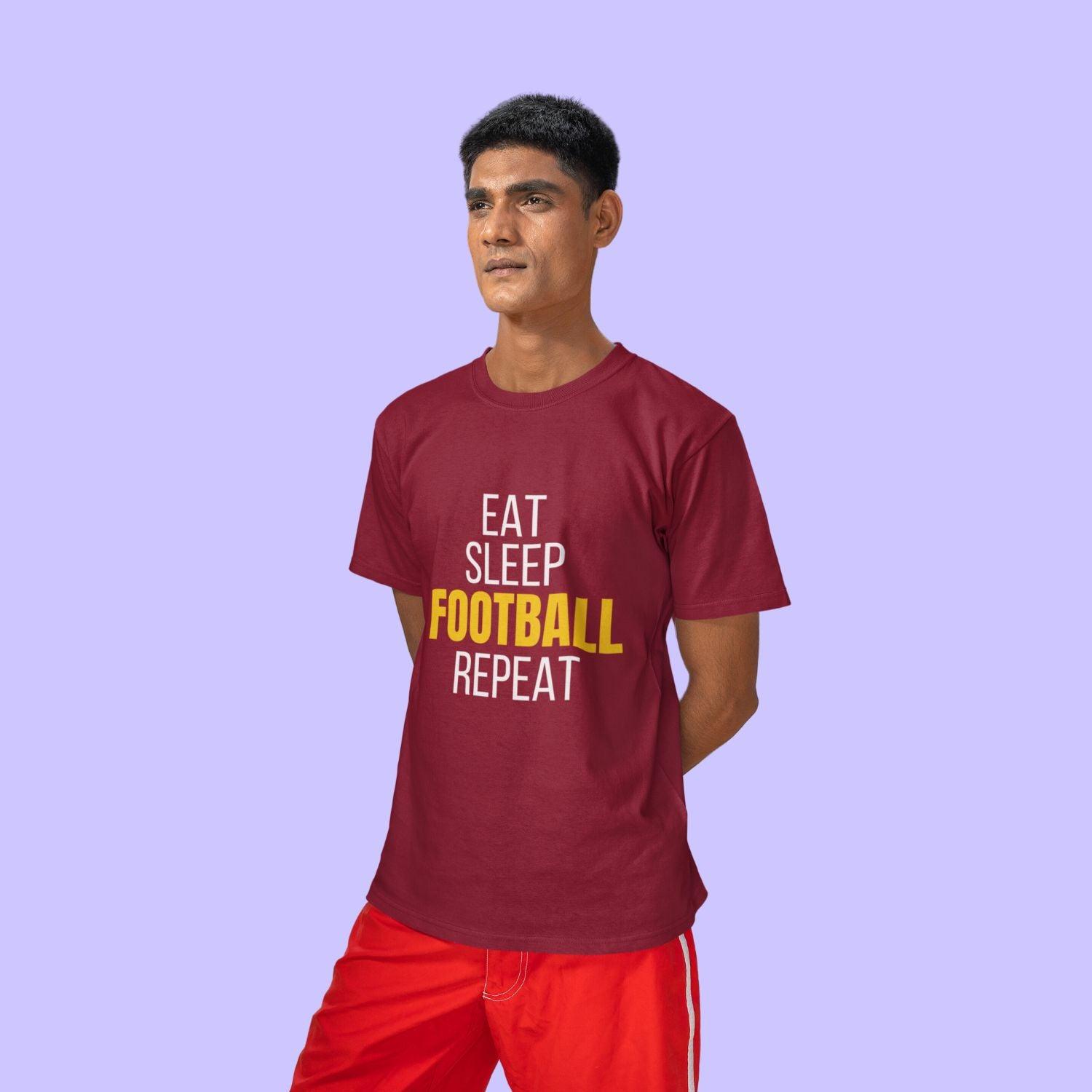 Eat Sleep Football Repeat Men's T-shirt by RedBerry Cuddle, made from 100% cotton. It features a fun, football-themed slogan, perfect for sports enthusiasts looking for comfort and style.