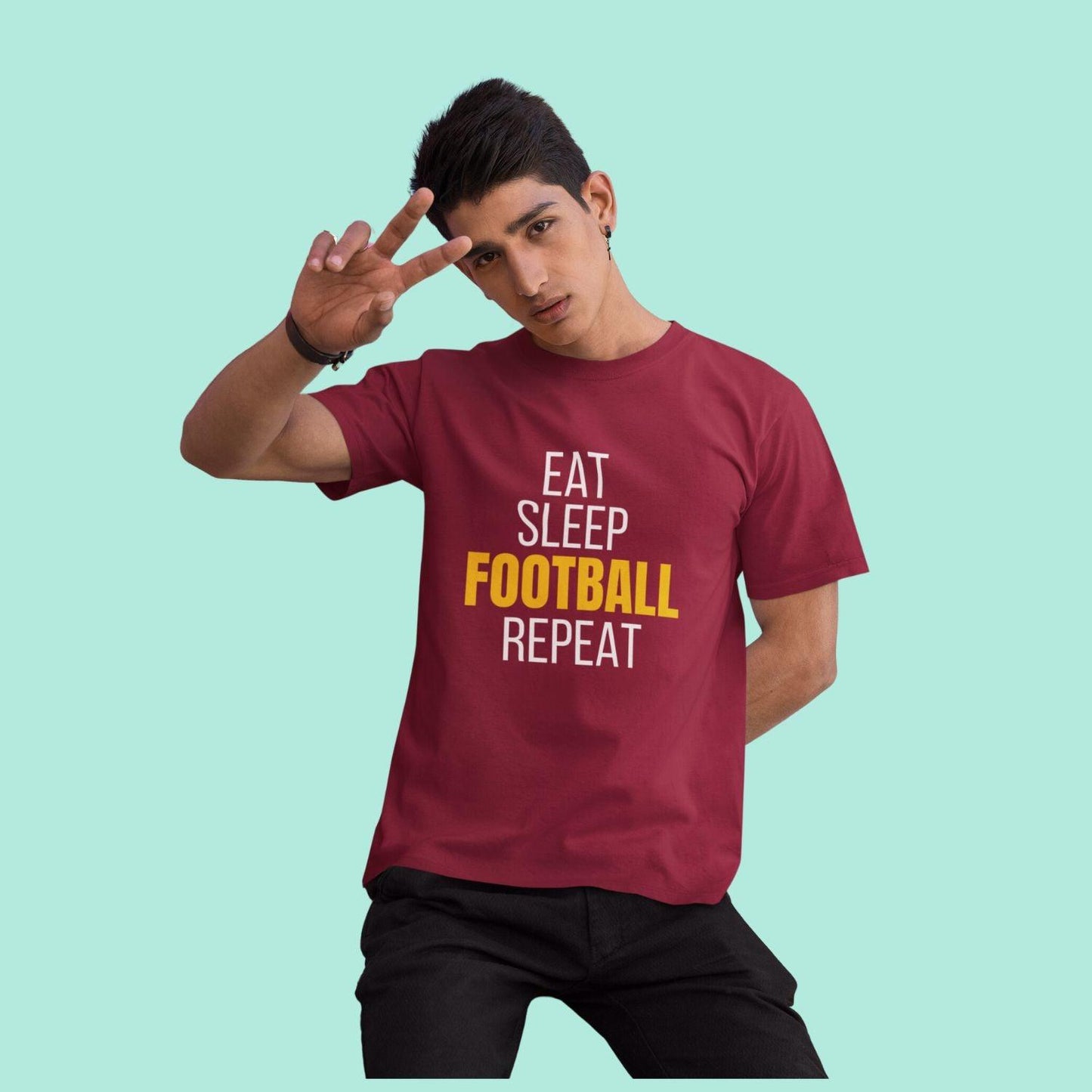 Eat Sleep Football Repeat Men's T-shirt by RedBerry Cuddle, made from 100% cotton. It features a fun, football-themed slogan, perfect for sports enthusiasts looking for comfort and style.