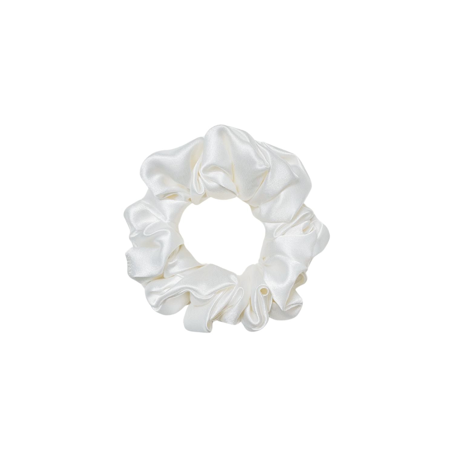 White Scrunchie in small size by RedBerry Cuddle. A classic, soft white hair accessory with a plush texture, designed for a secure and stylish hold.