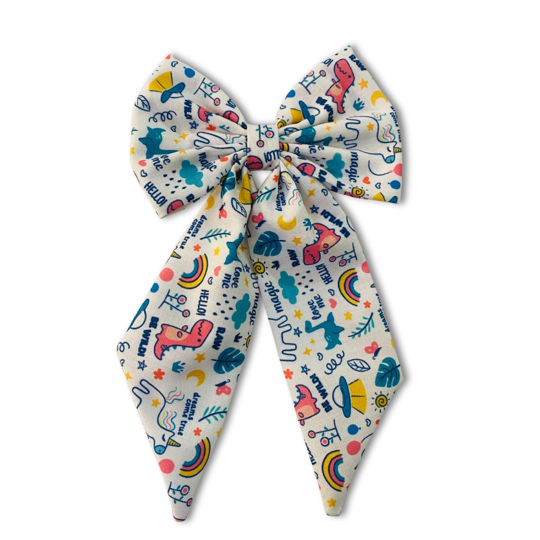 Magic Doodle Midi Tail Hair Bow by RedBerry Cuddle. A playful and stylish hair accessory featuring a midi-length bow with a whimsical doodle-inspired design, crafted from soft, high-quality fabric for a secure and charming look.
