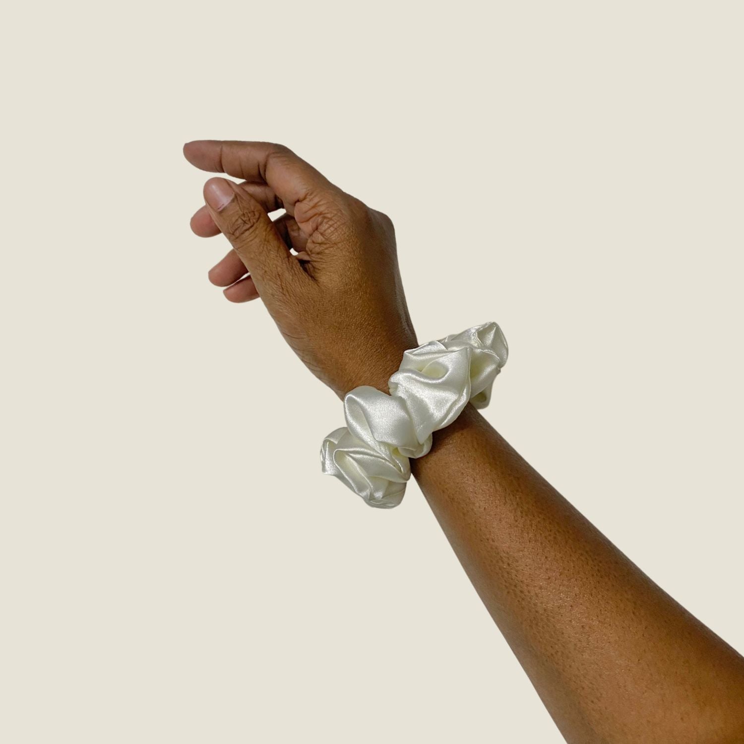 White Scrunchie in small size by RedBerry Cuddle. A classic, soft white hair accessory with a plush texture, designed for a secure and stylish hold.