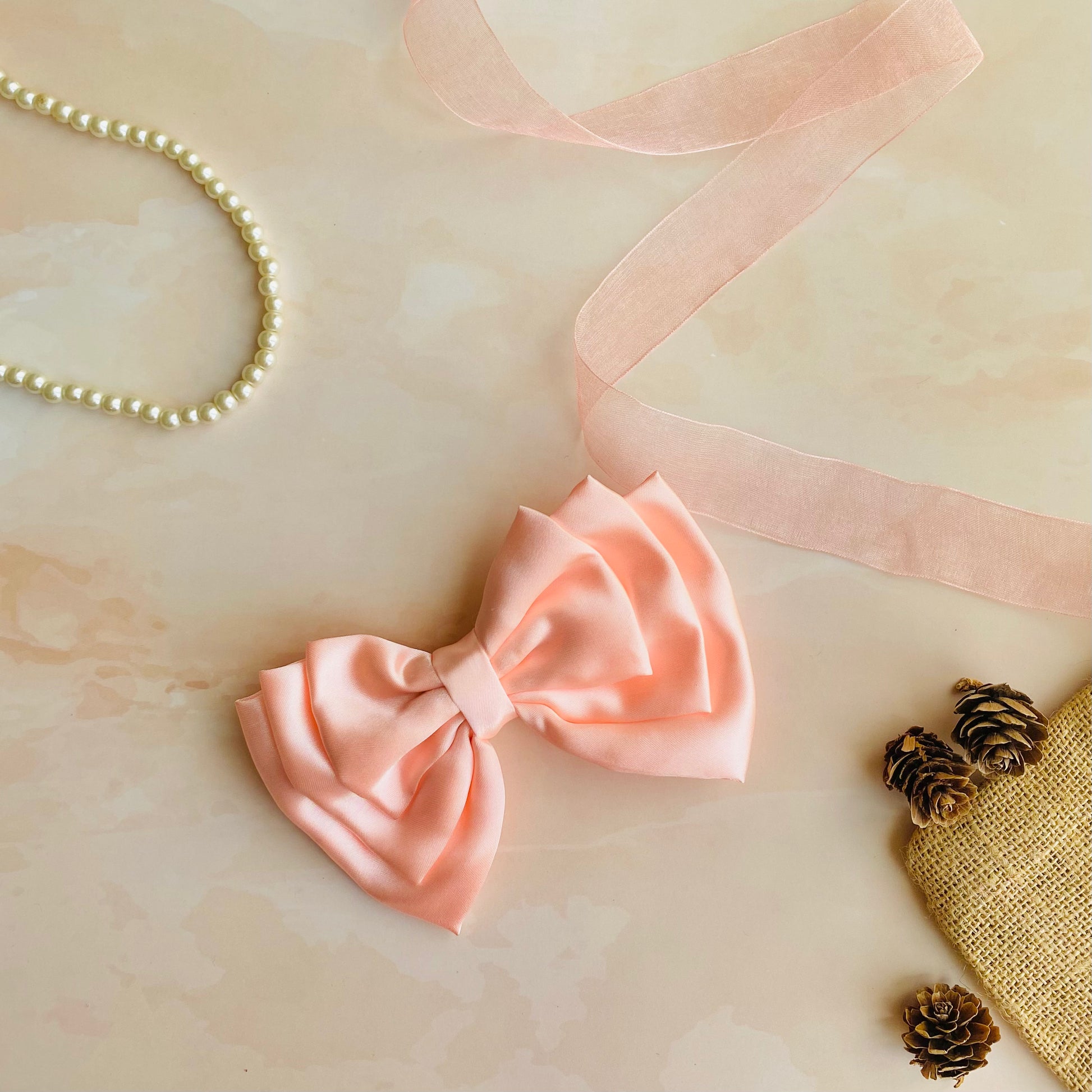 Flamingo Pink Triple Layer Hair Bow by RedBerry Cuddle. A vibrant and stylish hair accessory featuring a triple-layered bow design in a lively flamingo pink shade, crafted from high-quality fabric for a secure and eye-catching look.