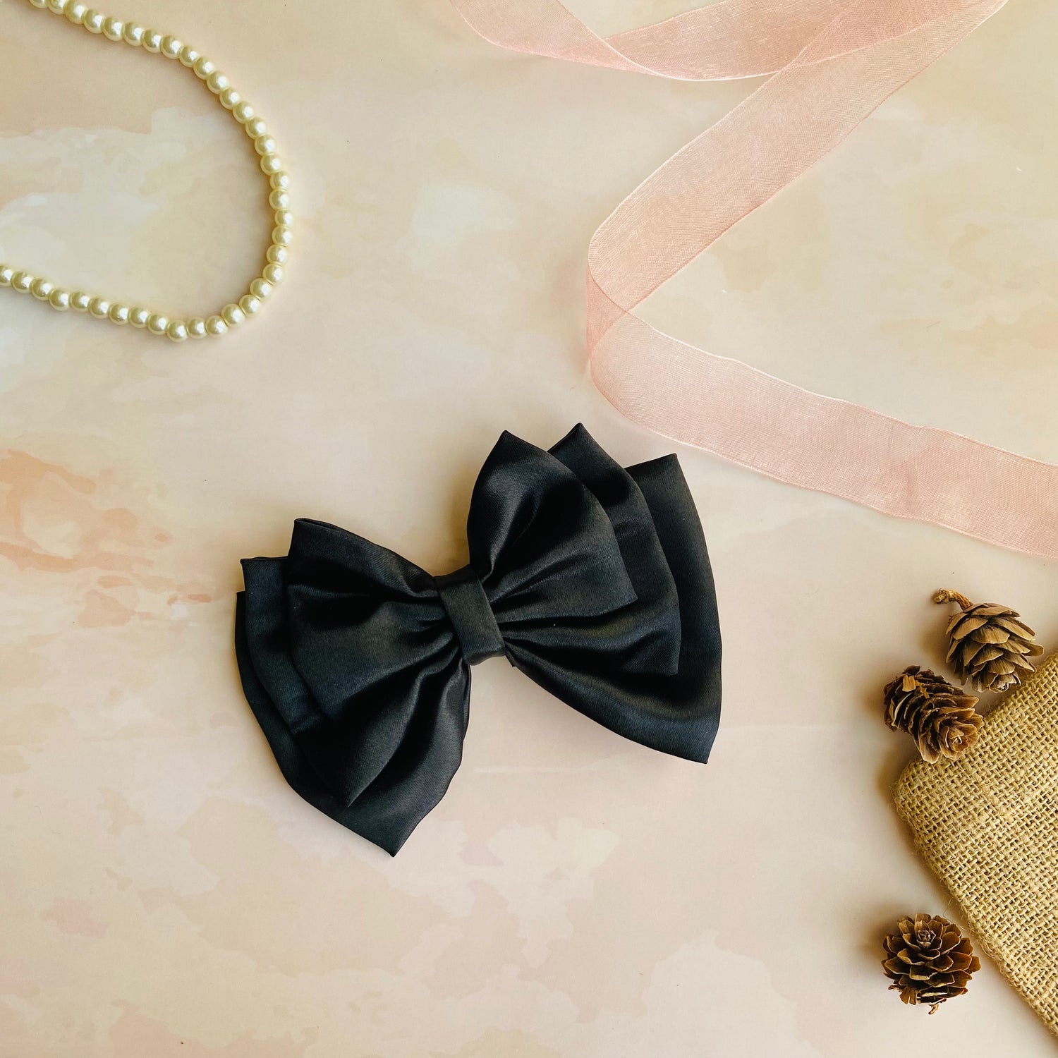 Black Triple Layer Hair Bow by RedBerry Cuddle. A timeless and versatile hair accessory featuring a triple-layered bow design in a classic black shade, crafted from high-quality fabric for a secure and sophisticated look.