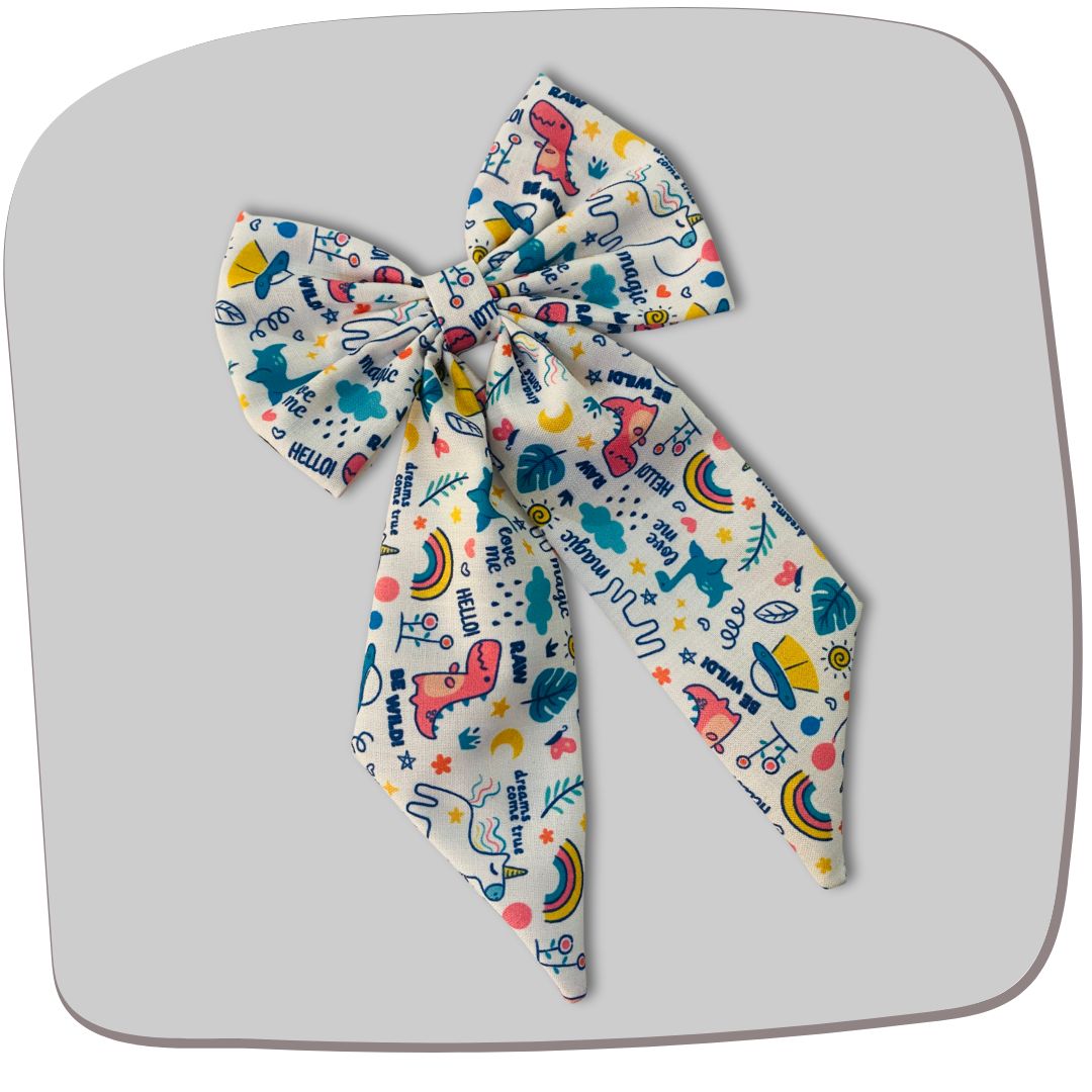 Magic Doodle Midi Tail Hair Bow by RedBerry Cuddle. A playful and stylish hair accessory featuring a midi-length bow with a whimsical doodle-inspired design, crafted from soft, high-quality fabric for a secure and charming look.