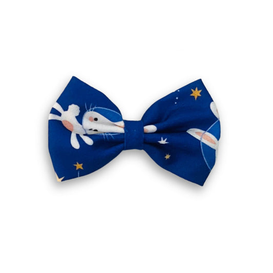 Bunny Space Classic Hair Bow by RedBerry Cuddle. A whimsical and adorable hair accessory featuring a classic bow with a playful bunny and space-themed design, crafted from high-quality fabric for a secure and charming look.