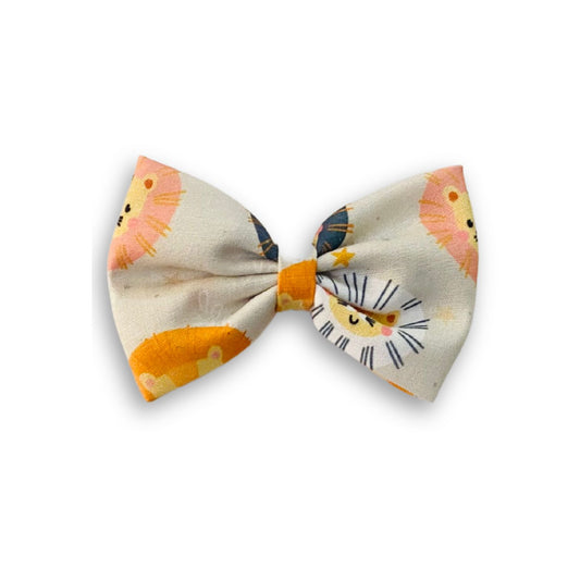 Lion Classic Hair Bow by RedBerry Cuddle. A bold and stylish hair accessory featuring a classic bow with a majestic lion-inspired design, crafted from high-quality fabric for a secure and fashionable look.