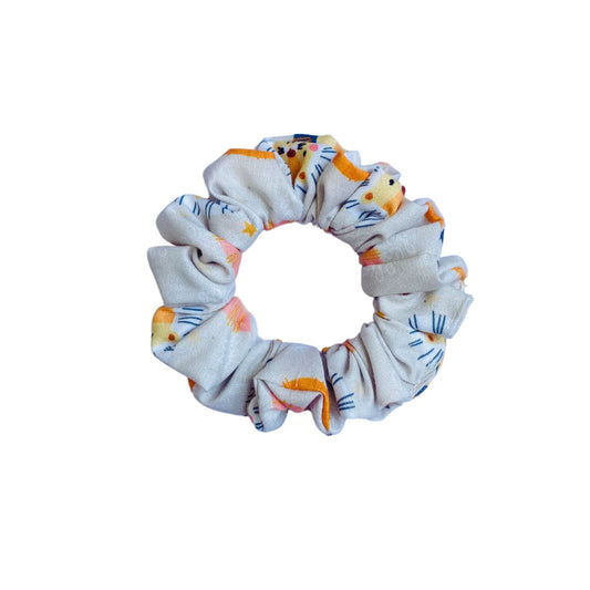 Lion Scrunchie by RedBerry Cuddle. A bold and stylish hair accessory featuring a majestic lion-inspired design, crafted from high-quality fabric for a secure and fashionable hold.