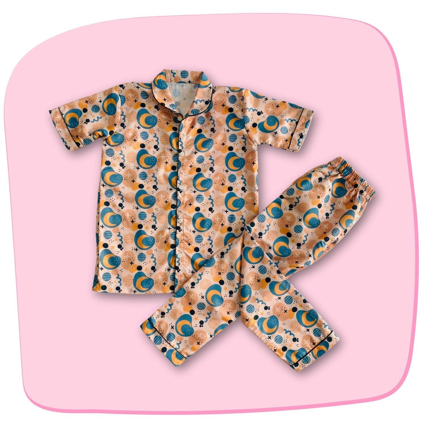 Moon Doodle Pajama Set by RedBerry Cuddle, made from 100% cotton. A soft and cozy unisex pajama set for kids, featuring playful moon doodle designs, perfect for a comfortable and restful night's sleep.